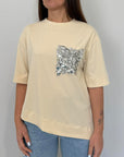 Tensione In - T-shirt con tasca in paillettes asimmetrica avorio