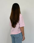 Tensione In - T-shirt con tasca in paillettes asimmetrica rosa