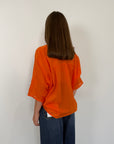 Tensione in - Camicia in mussola di cotone papaya