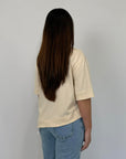 Tensione In - T-shirt con tasca in paillettes asimmetrica avorio